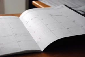 An open monthly planner used to map out a fall test retake schedule